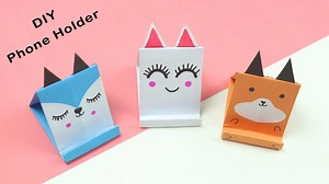 31K views · 1.1K reactions | How To Make Origami Paper Phone Holder | DIY Paper Mobile Stand #mobilestand #paperphonestand #phoneholders #origamiphonestand #origamipapermobilestand #papercraft #diy #howtomake #origamicraft | Ezzy Crafts DIY | Facebook