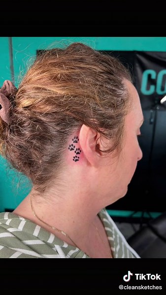 Paw prints for her dogs! 🐾 #tattoo #tattooartist #tatted #tattooideas #satisfying #tattoos #tattoolover #tattootiktok #tattoogirl #tattooed #tattooart #tattoostencil #smalltattoo #behindtheeartattoo #behindtheeartattoos