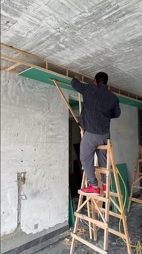 The process of installing drywall on the ceiling