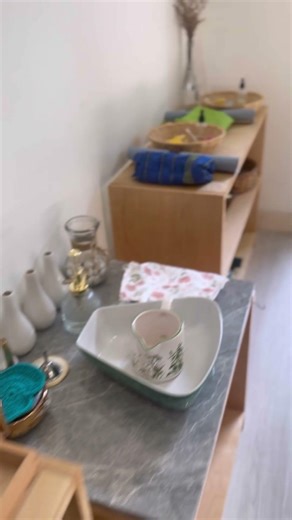 A beautifully arranged Practical Life lessons shelf at Olea School Montessori #montessori