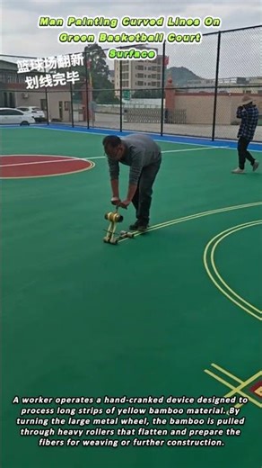 Man Painting Curved Lines On Green Basketball Court Surface
