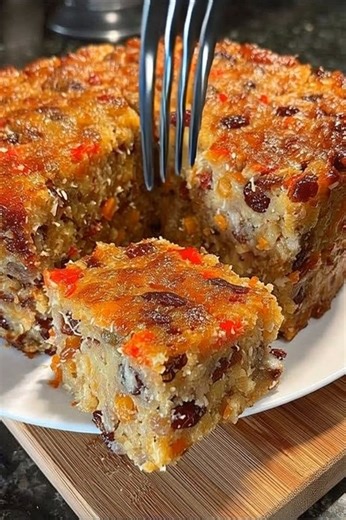🎄 Never-Fail Fruit Cake: The Moist, Irresistible Recipe That Converts Fruit Cake Skeptics! 🍊 This isn’t your grandma’s dry fruit cake — this one tastes like Christmas candy in cake form! Let’s be honest, most of us have avoided fruit cake at least once. Those dense, dry loaves with neon-colored fruit just didn’t do it for me either. But this version? It completely changed my mind. The secret is simple: sweetened condensed milk. It gives the cake incredible moisture and richness, making it soft