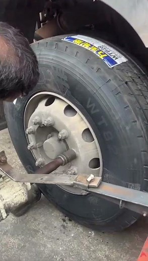 removing car wheel bolts with an impactor