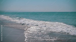 Slow Motion Ocean Waves with Sun Reflection