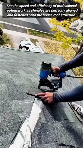 Expert Roofer Installing New Shingles On A Home Roof
