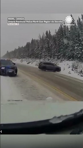 Close Call: Officer Dodges Vehicle Skidding Toward Him in Snowstorm
