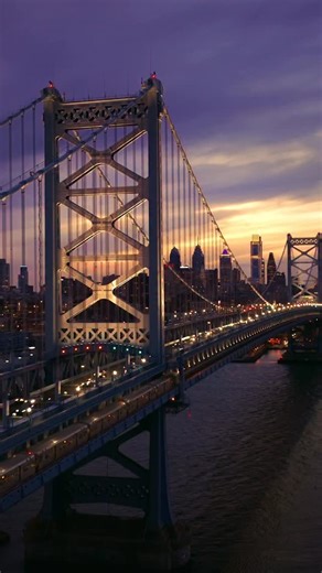 The Benjamin Franklin Bridge glowing into the evening hours with the Philly skyline in the background ✨🌃 • Shout out to @billykyle for showing me around. Had a great time droning and grabbing a Philly cheese steak at @pats_king_of_steaks . . . Philly Skyline Photographer Blue Hour Philadelphia Pennsylvania Views Drone Dusk City Lights | Ovjphotography