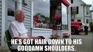 He's got hair down to his goddamn shoulders.