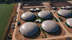 Download Production of green energy from biomass. Modern factory for organic fuel production. Circle movement over the biogas plant. for free