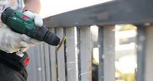 clip-1111733597-removing-rust-metal-using-wire-brush-on