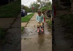 Kids Enjoy Hopping in Puddles After Rainfall