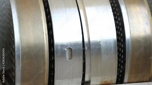 Molds for squeezing dough and shaping pasta. Different types of pasta molds in a macaroni factory. Industrial production of pasta. Macaroni factory and pasta production stages. Spaghetti manufacturing