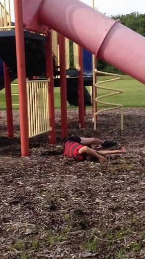 Kid falls off park slide! (Nut shot!)
