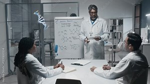 Mature Indian scientist presenting ammonia reaction formulae on whiteboard during meeting with young lab assistants, discussing development of new revolutionary drug in modern laboratory