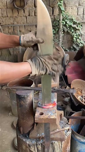 Traditional Blacksmith Installing a Hand-Forged Knife Guard