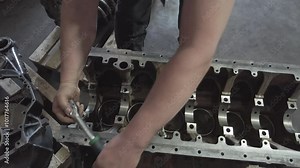 Mechanic Rebuilding Diesel Engine for Tractor
