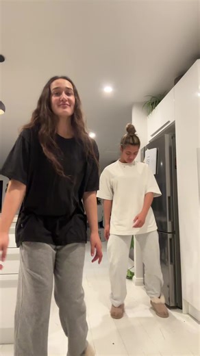 Coordinated Dance Routine in Modern Kitchen