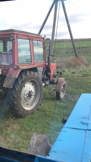 Old Tractor Plowing Field: A Rustic Farming Scene