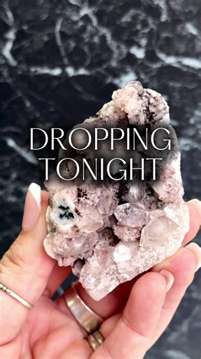 A beautiful and uncommon pairing, Apophyllite on Pink Chalcedony feels like crystal sparkle scattered across soft blush clouds. While Apophyllite itself is a well-known mineral, seeing those glassy, light-catching crystals growing over gentle pink Chalcedony is far less common, and the contrast between the two is something truly special. Apophyllite forms in bright, geometric points that catch the light like tiny mirrors, while Pink Chalcedony brings a soft, calming base that almost glows beneat