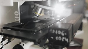 The moving part of a fluorescence microscope. Modern microscope. Modern scientific laboratory and equipment. Laboratory and medical equipment.