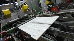 Porcelain stoneware and ceramic tile factory, from inside. Production processes. Ceramic tiles manufacturing. Production of ceramic tiles.