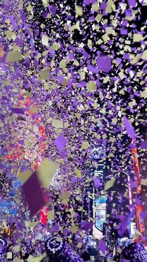 The first Times Square New Year’s confetti at the 10 PM countdown 💜💛