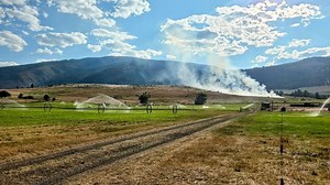 Grass fire in Lolo sparked by hay swather, extinguished with rapid response