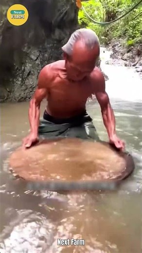 Master of Artisanal Gold Panning with an Impressive Wooden Basin!