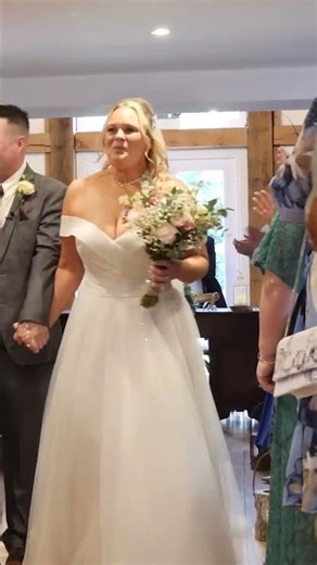 bride and groom walk up the aisle