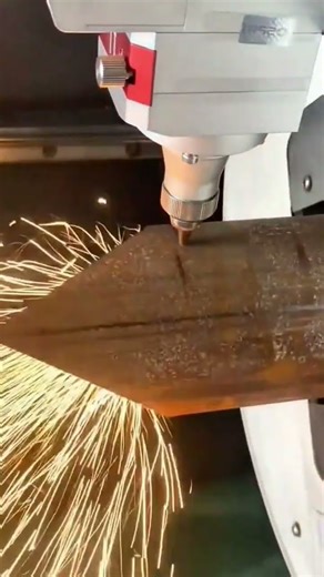 Laser Cutting Thick Metal Plate Producing Bright Flying Sparks