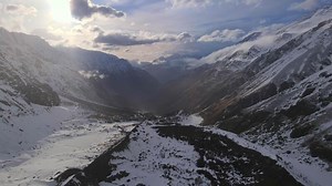Majestic mountains winter view from above Majestic mountains showcasing splendor snowy peaks. Majestic mountains symbolize tranquility northern wilderness Wintry splendor serene aerial view.