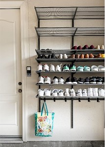 Shoe piles and bag tangles, BE GONE! 👋🛠️💙 Create a garage mudroom that’s all about smart storage and stylish organization with the help of Garage by Elfa! SHOP online: https://container.store/3Nk0cbn @simplyorganized chose Elfa for its easy setup, shelving for her client's shoes, hangers for bag storage, and shelf liners to keep shoes from dropping dirt. | The Container Store