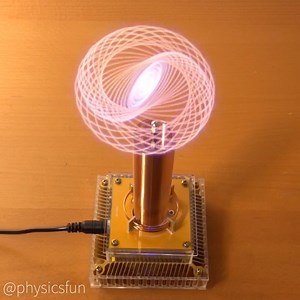 physicsfun on Instagram: "Corona Discharge Trajectories: the ejected electron stream propels the end of a thin wire connected to a miniature Tesla coil. The corona discharge creates a glowing plasma at the end of the wire, but also imparts momenta that pushes the wire’s end into a final state circular orbit. The more interesting behavior occurs during the initial transient orbits which seem to be hypotrochoid type curves beautifully captured here using the Slow Shutter app. ➡️ Follow the link in