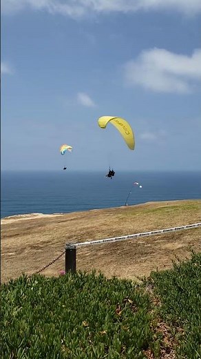 Paragliding above the ocean at Torrey Pines Gliderport, La Jolla in San Diego, California