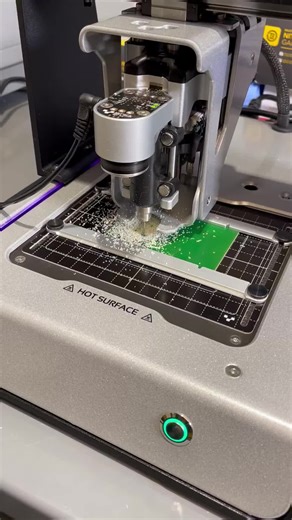What's all this mess about?! This is V-One drilling vias and through-holes for a double-sided #PCB prototype. #Voltera #VolteraVOne #CircuitBoard