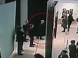 CCTV shows a man stealing a painting in front of staff and visitors