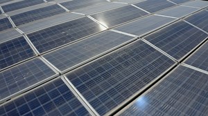 View of a solar power farm in a rural valley - Free Stock Video