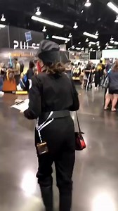 A cosplayer walks around as Dolores, an Imperial HR officer, at Celebration Anaheim 2022 | Star Wars Fans