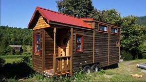 For sale here: https://tinyhouselistings.com/listings/brand-new-dogwood-tiny-house-24 "The gorgeous 24' Dogwood Tiny House was custom built in Western North Carolina. It is completely custom made, all the cabinetry and stained glass was done in the builder's shop. Hand cut cedar shingles on the gable, wormy maple counter top, walnut, alder and cypress in the trim and cabinetry. It is well insulated with Rockwool and very sturdy." The world's tiny house marketplace: http://tinyhouselistings.com F