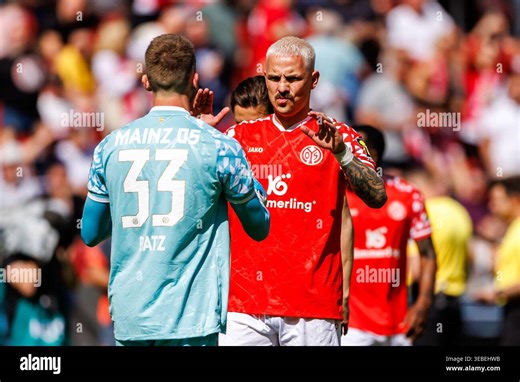 MAINZ, GERMANY - APRIL 25: Daniel Batz (1. FSV Mainz 05, 33) and Phillip Tietz (1. FSV Mainz 05, 20) during the Bundesliga match between 1. FSV Mainz 05 vs. FC Bayern Munich at MEWA Arena on matchday 31 of the 1. Bundesliga on April 25, 2026 in Mainz, Germany. DFL REGULATIONS PROHIBIT ANY USE OF PHOTOGRAPHS AS IMAGE SEQUENCES AND/OR QUASI-VIDEO Stock Photo - Alamy