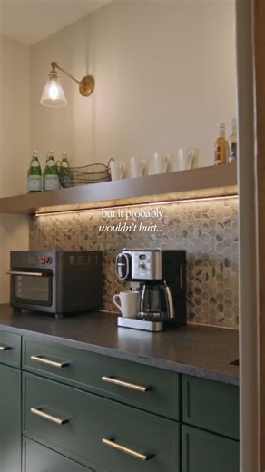 A hidden butler's pantry with a coffee bar might not be the solution to all your problems, but you won't know if you don't try. 😉 #homeinspo #customkitchen #customhome #grandrapids | Eagle Creek Homes