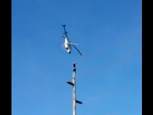 Crazy Helicopter stalled turned while crop dusting over power lines
