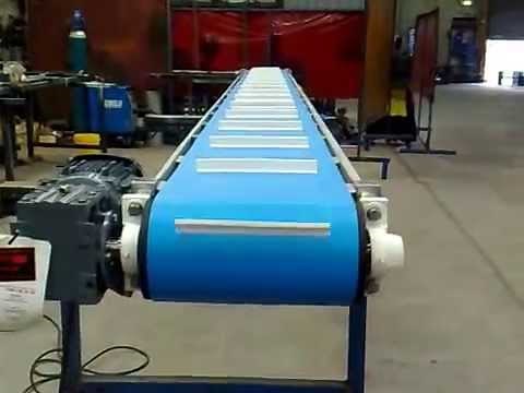 Cleated belt conveyors