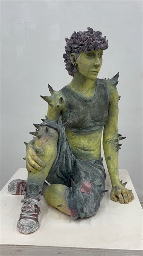 Instagram on Instagram: "A self-portrait with a whimsical twist ✨ @thistle_makes_art (Jay) sculpts himself in clay adding spikes and green skin. To spark creativity, Jay likes to listen to music that matches the mood he wants to capture: “Sounds and lyrics inspire my imagination and help me to conceptualize artworks.” Jay’s work ranges from colored pencil drawings to ceramic pins, with his social media acting as a living portfolio for his art. “I like to think of my page as a documentation of my