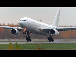 All-white I-Fly Airbus A330-200 smooth landing on a slightly wet runway at LED.