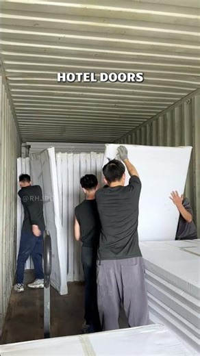 Hotel room doors custom-made for overseas clients are being loaded into containers again.