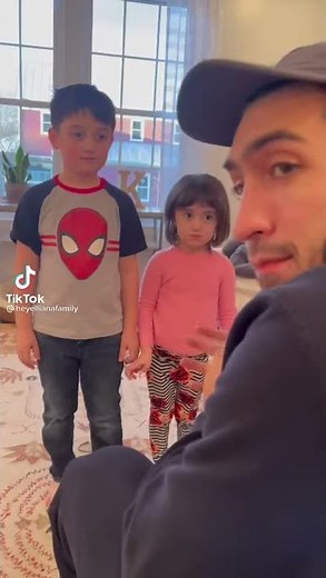 dad tickles his kids to see their reaction