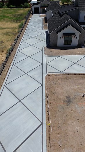 Hard to beat this incredibly custom driveway! Making that statement entry. #fyp #driveway #pavers #concrete #decorative #decorativedriveway #house #design #interiordesign #aftconstruction