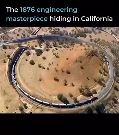 CertifiedExpert on Instagram: "Most people drive past it without knowing what they’re missing. The Tehachapi Loop is a railway spiral that makes trains pass over themselves to climb mountains. Built in 1876, it’s a 0.73-mile curve that gains 77 feet in elevation while keeping the grade manageable. Long freight trains literally cross over their own tracks. The engine passes above the rear cars of the same train. Nearly 40 trains use this loop every single day. A 150-year-old solution that still w