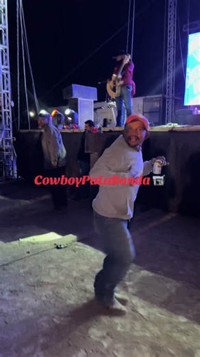 Energetic Cowboy Dance Performance Under Stage Lights